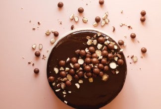 Chocolate cake topped with malted milk powder